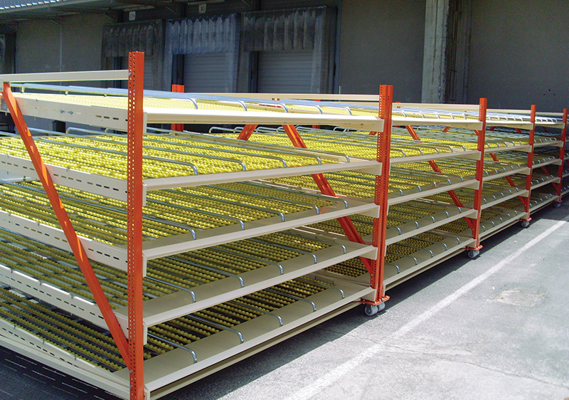 Carton flow rack and integrated conveyor